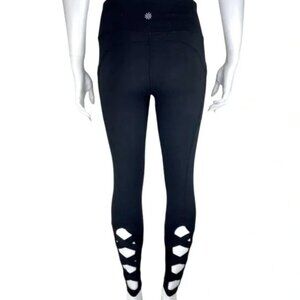Athleta black leggings cutout elastic bottoms with pockets - size XS